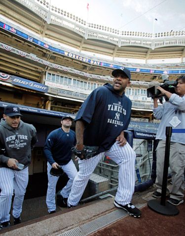 Yankees pitchers CC Sabathia, Joba Chamberlain and Andy Pettitte emerge from the clubhouse to workout on Tuesday. Sabathia starts tonight's game against the Twins.